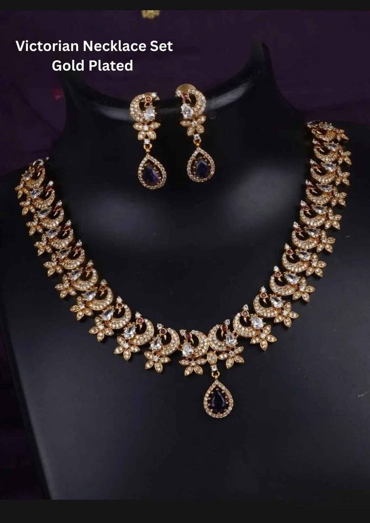 Gold-plated necklace and earrings with purple gemstones 