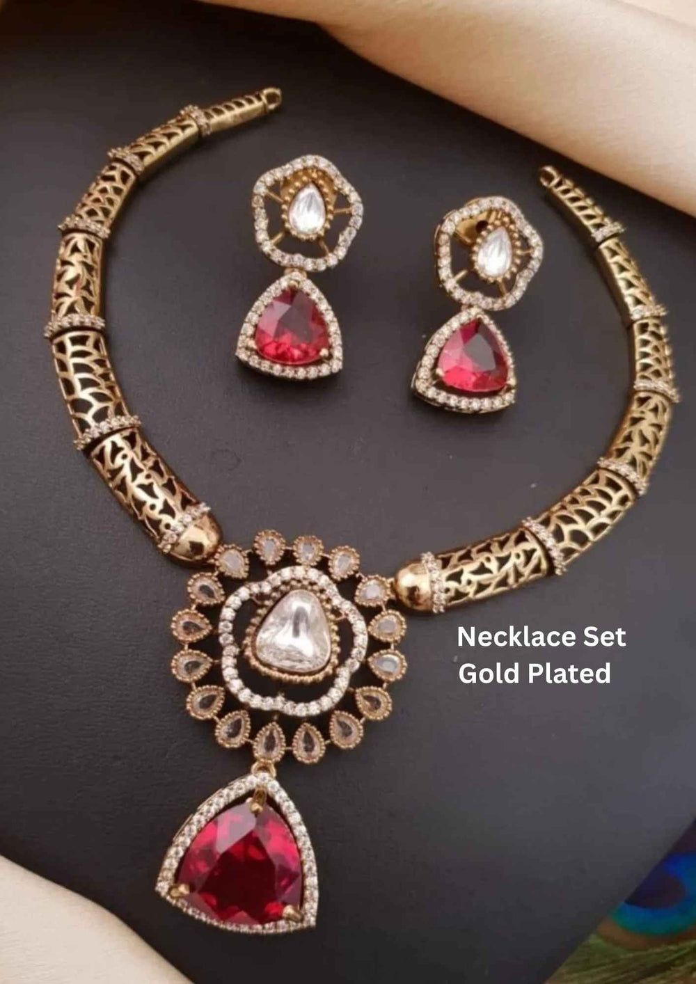 Gold-plated necklace set with red gemstones