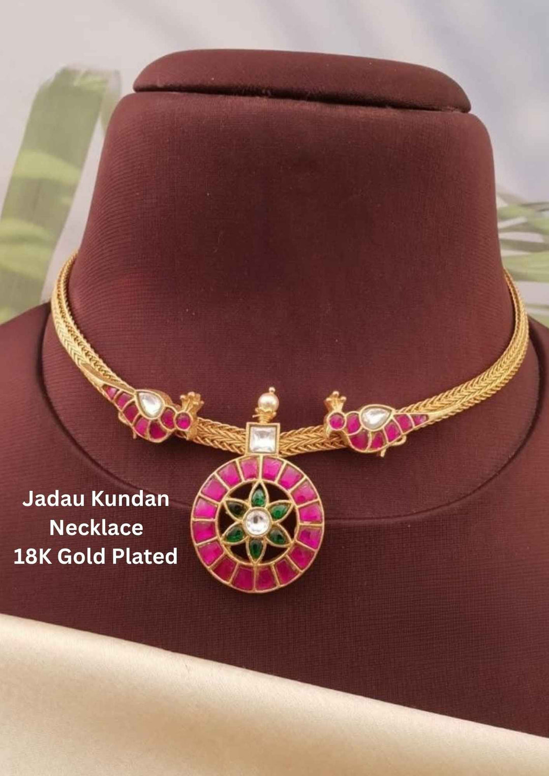 Gold-plated necklace with red and green stones