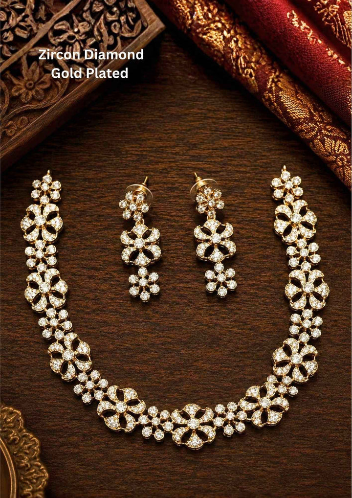 Gold-plated zircon diamond necklace and earrings comes with flower design and shows in detailed how it look and looks very classy and neat finishing and can be use for festival , weeding and can gift 
