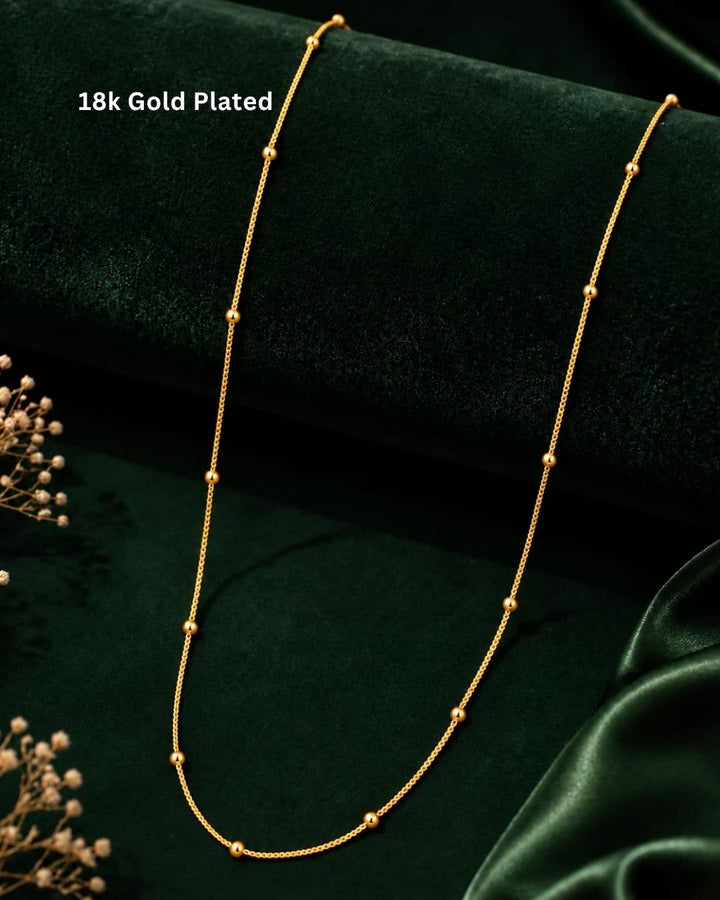 Beautiful gold plated beaded chain featuring polished spherical gold beads arranged along a delicate chain. Perfect for daily wear, office wear, festive occasions, traditional outfits, and premium gifting.