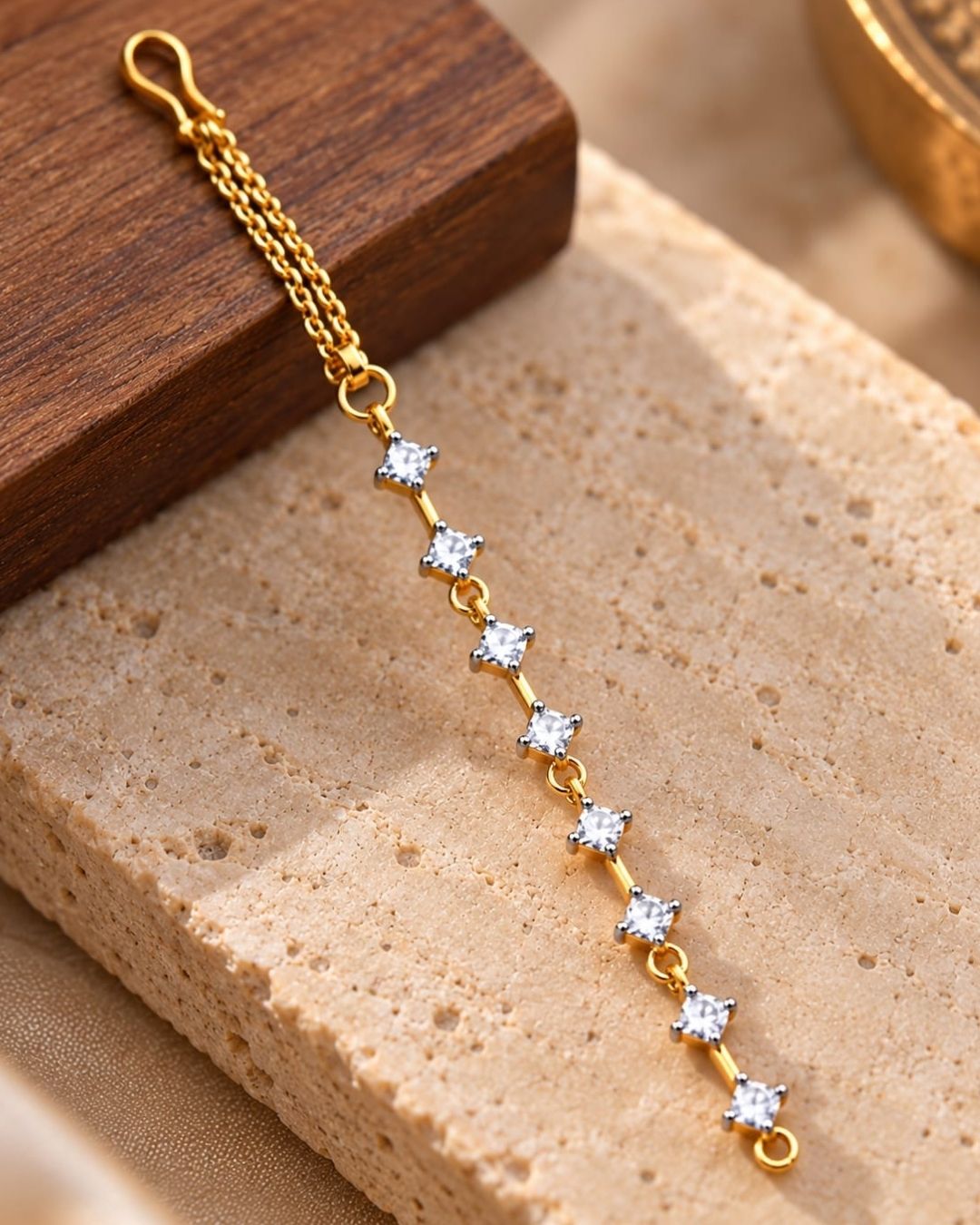 Gold plated designer ear chains featuring sparkling white square zircon stones arranged in a vertical pattern with delicate gold links.