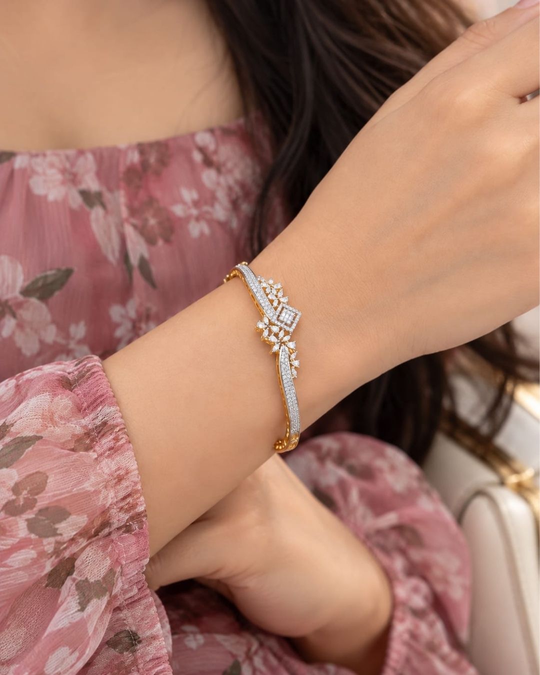 Gold plated openable bracelet featuring a dual-tone gold and silver finish with sparkling white CZ stones and intricate floral embellishments.