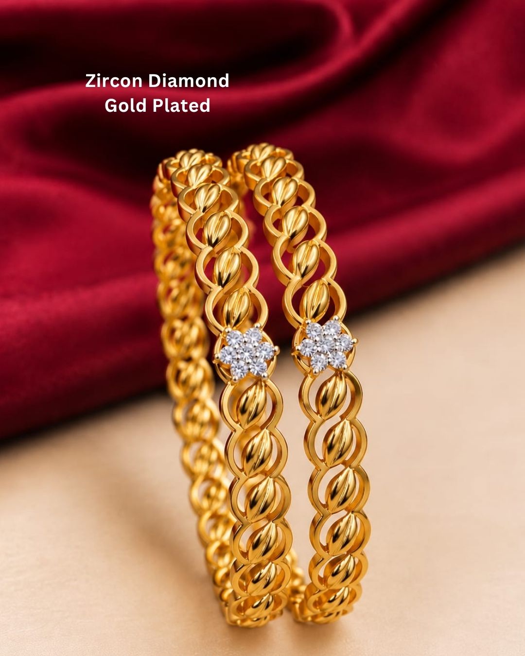 Beautiful gold plated bangles featuring a repeating twisted leaf pattern with floral stone accents at the center. Perfect for traditional wear, festive occasions, weddings, daily wear, and gifting.