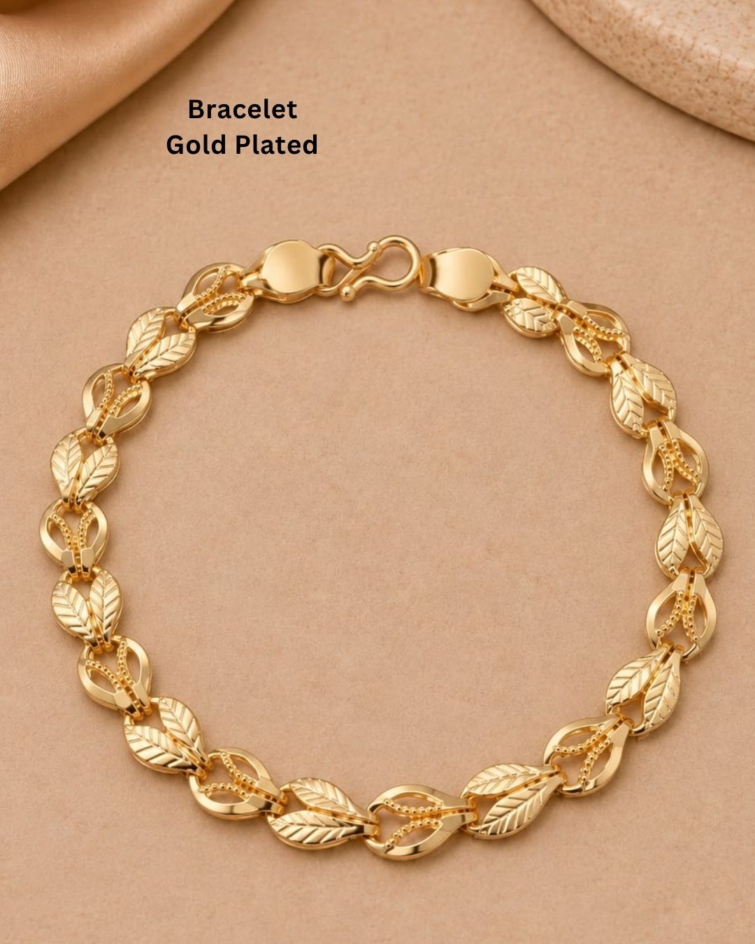 Beautiful gold plated bracelet featuring repeating leaf-shaped links with detailed vein patterns and polished connecting elements. Perfect for traditional wear, festive occasions, daily wear, and gifting.