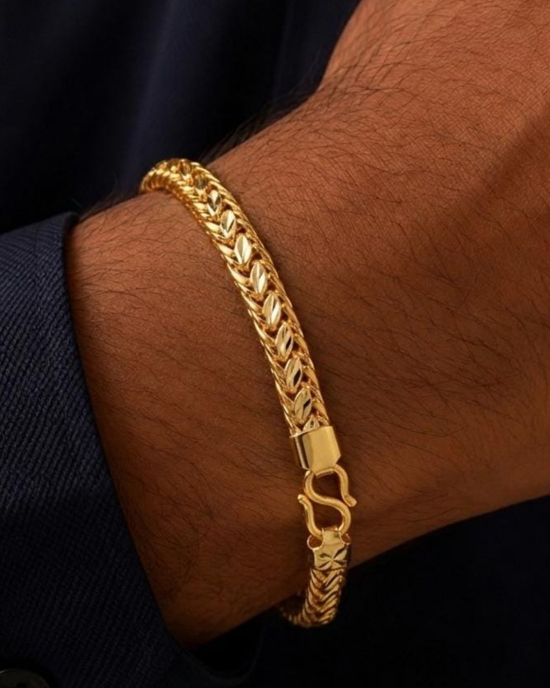 Beautiful gold plated bracelet featuring a repeating leaf pattern with detailed interwoven chain links and a classic hook clasp. Perfect for traditional wear, festive occasions, weddings, daily wear, and gifting.