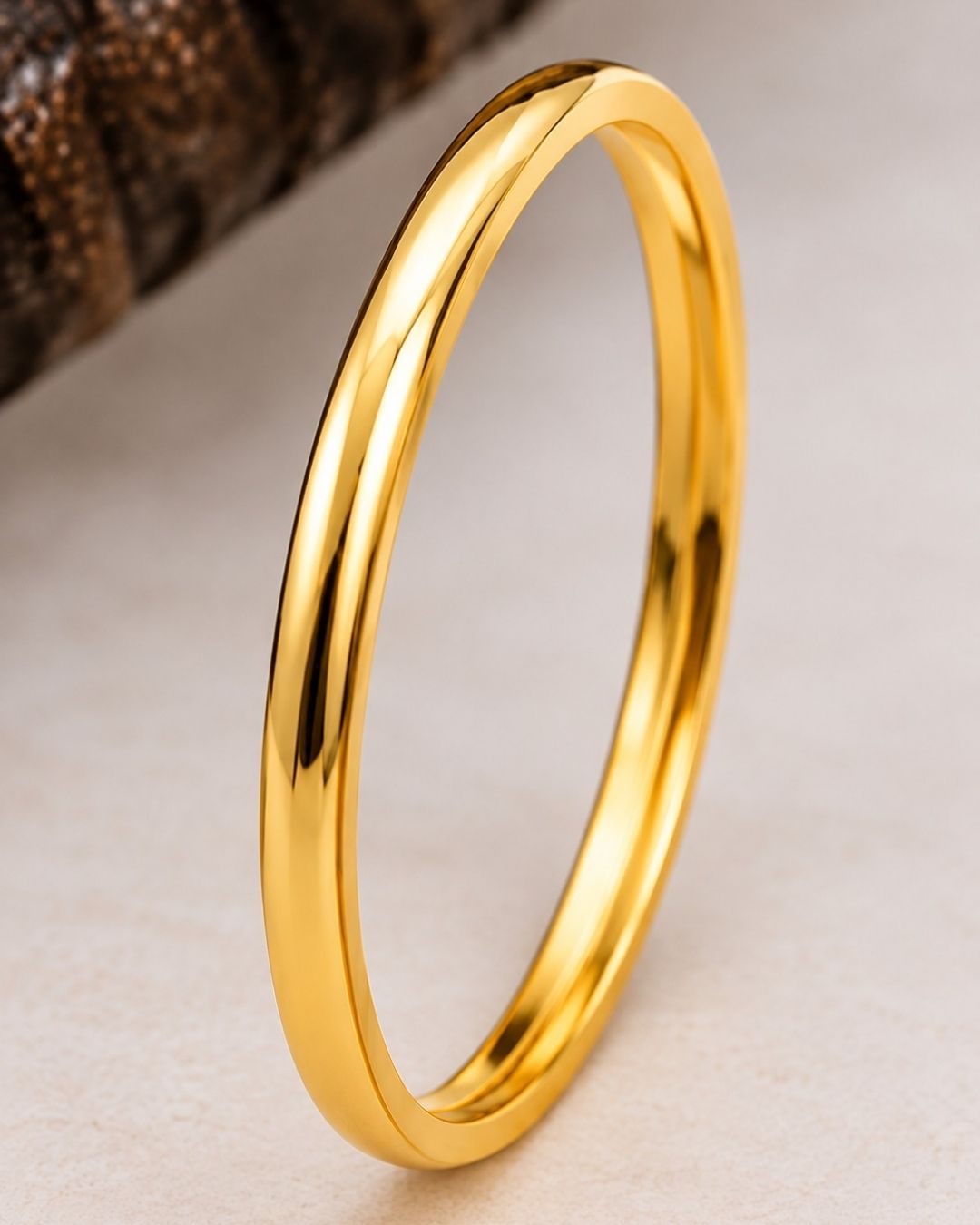 Four slim gold-plated rings stacked together Classic gold plated bangles with intricate engraved detailing for a timeless traditional look.