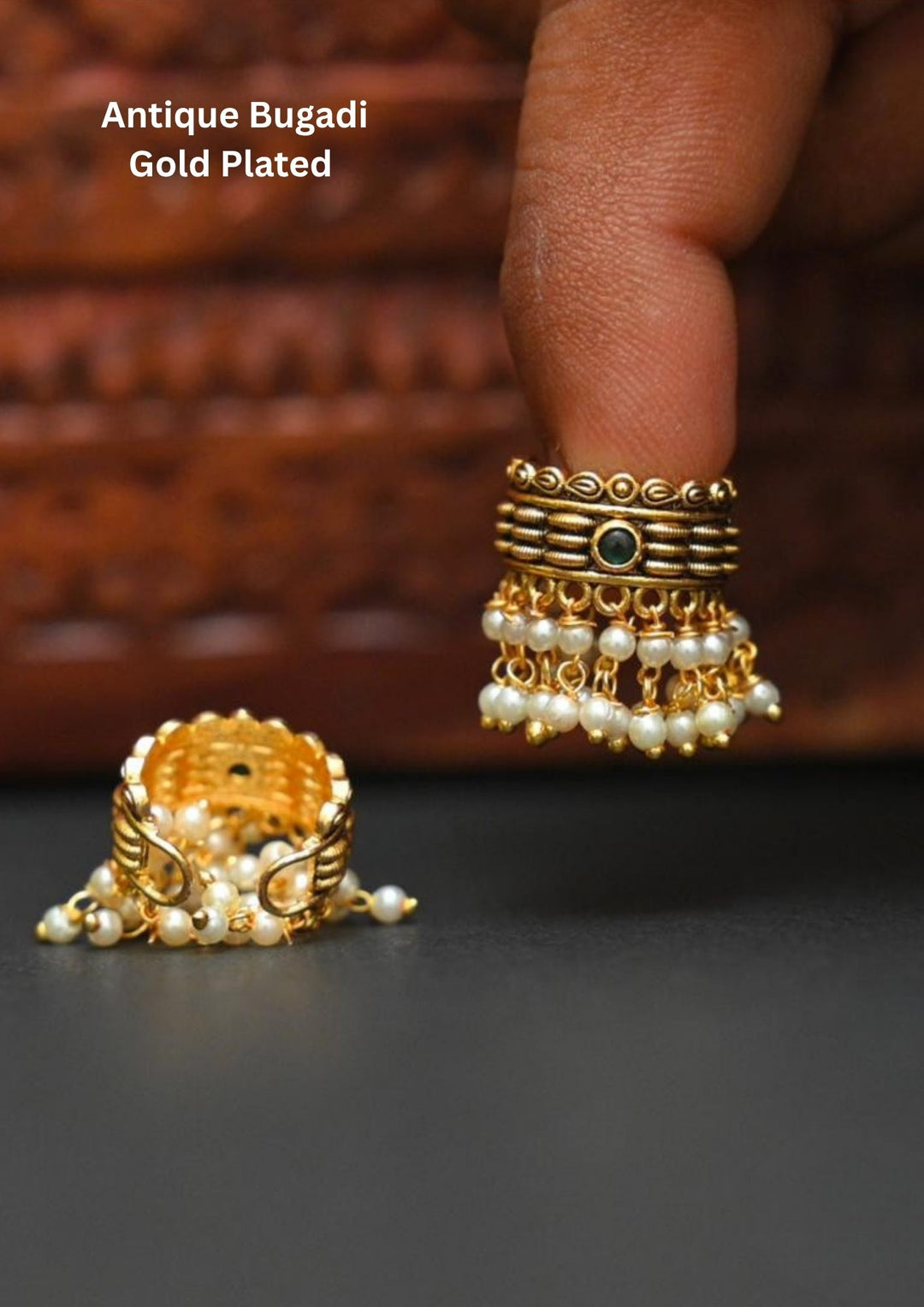 Gold-plated bugadi with pearl detailing and in picture clearly shows how it looks back and front  image and it comes with green gemstone and looks very elegant and can be used for festivals and weeding's   