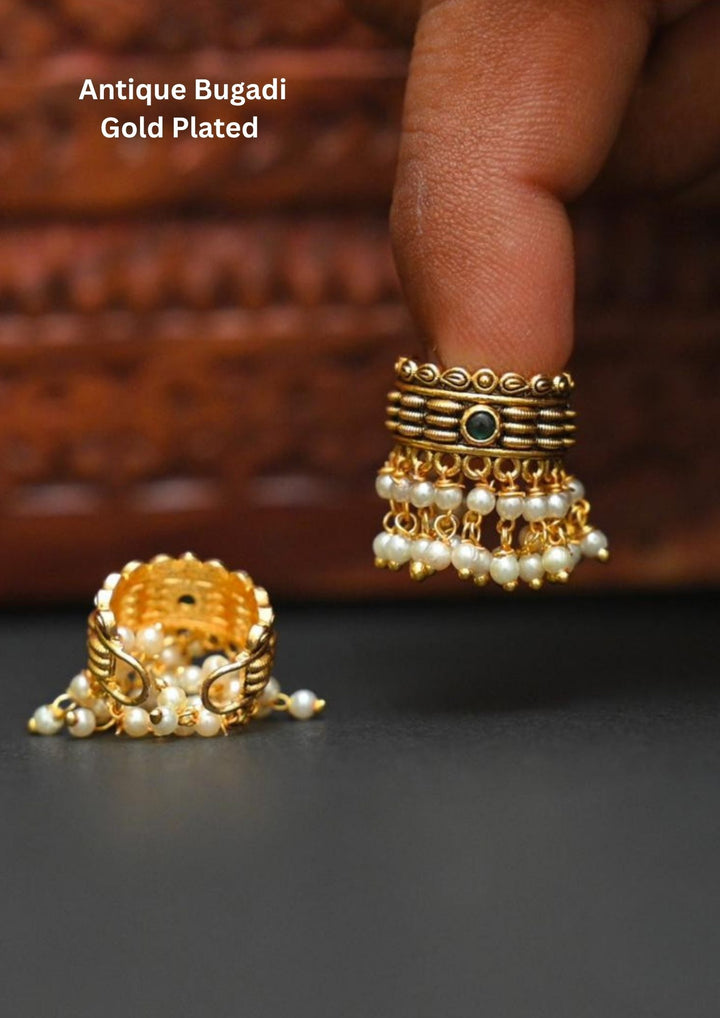 Gold-plated bugadi with pearl detailing and in picture clearly shows how it looks back and front  image and it comes with green gemstone and looks very elegant and can be used for festivals and weeding's   