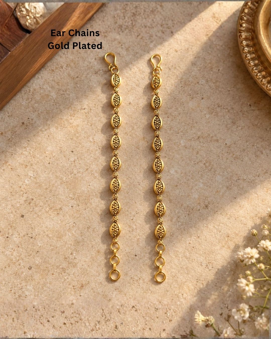Gold plated traditional ear chains featuring intricate oval motifs, antique-style detailing, and decorative gold bead links