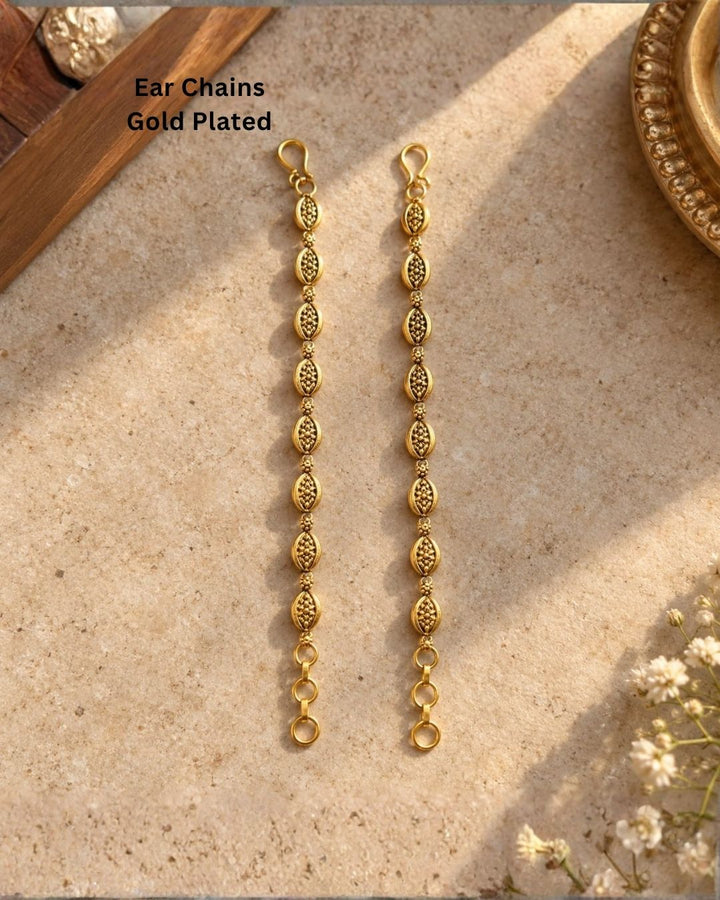 Gold plated traditional ear chains featuring intricate oval motifs, antique-style detailing, and decorative gold bead links