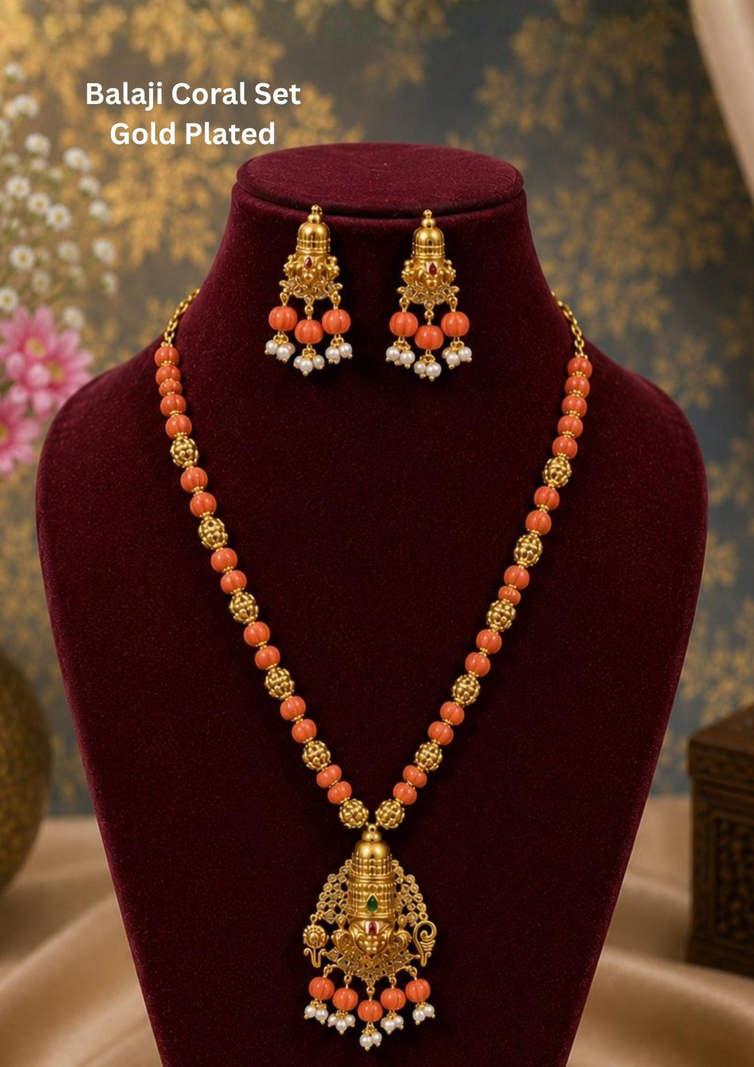 Gold Plated Balaji Coral set featuring a long bead necklace with a detailed Lord Venkateswara pendant and matching stud earrings. The set combines vibrant orange coral beads, textured gold spacer beads, a green crown stone, and completed with white pearl guttapusalu. Perfect for traditional wear, festivals, lightweight comfort, sweat proof quality, anti-fade colour, skin-friendly finish, and is suitable for weddings, pooja functions, 