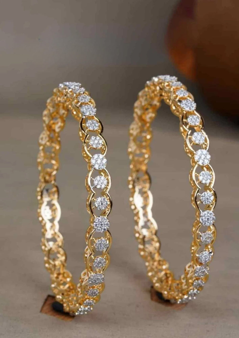 Gold plated zircon bangles with diamond