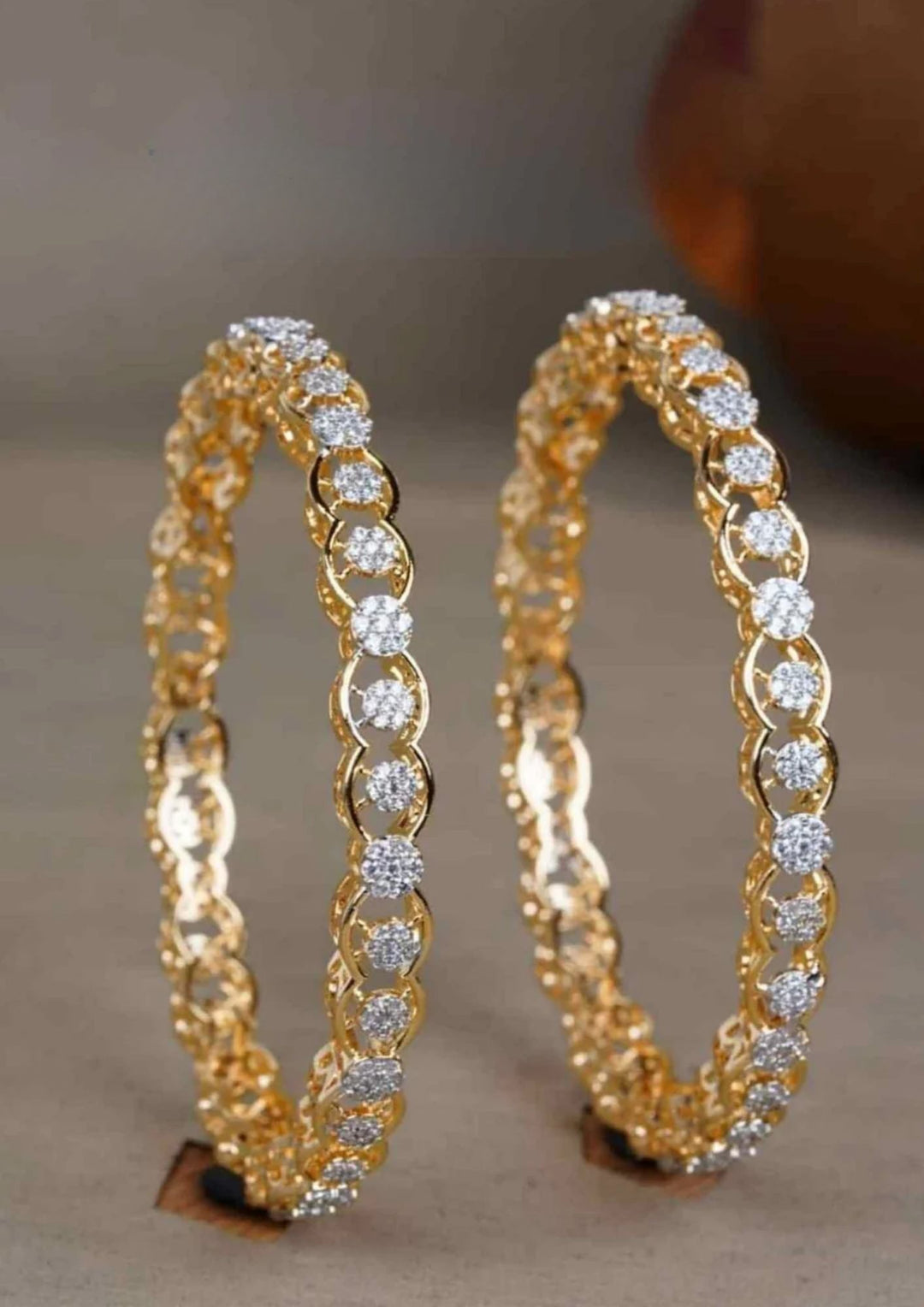 Gold plated zircon bangles with diamond