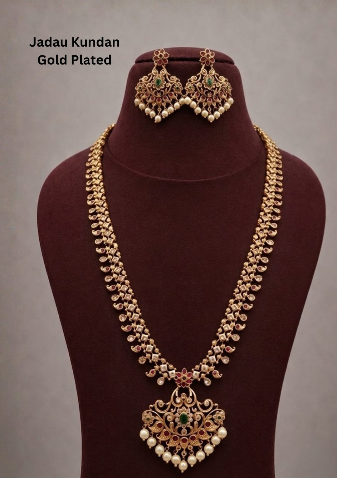 Gold-plated necklace design with long necklace with green and red stones come with jadau kundan in necklace with beads and in pendent shows clear design and in detailed shown in picture it will not fade color and water proof can used for festivals, bridals, and weeding's  