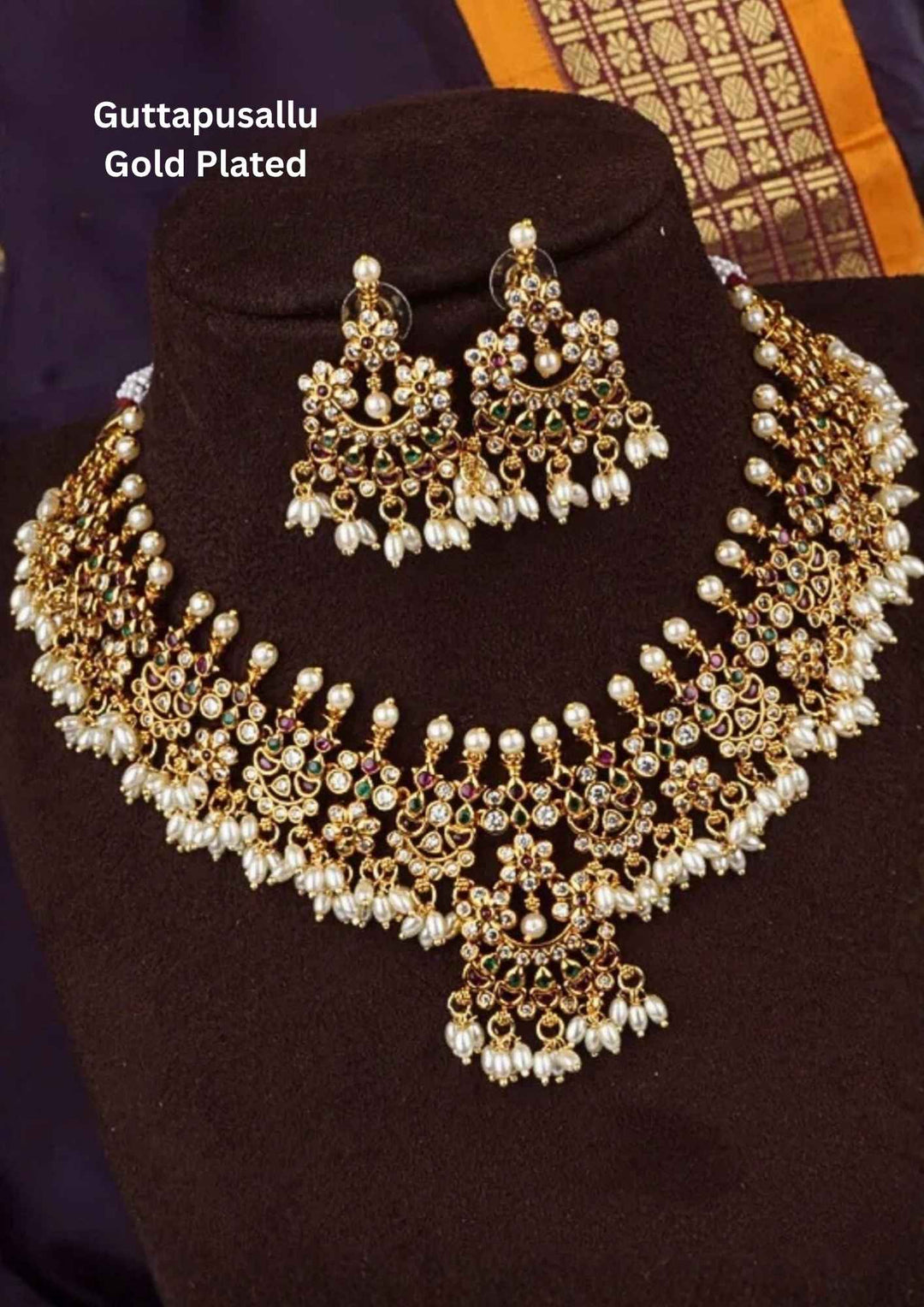 kundan gold plated guttapusallu necklace set for traditional ware and in picture jewelry looks very shine and can be used for traditional ware, weeding's , festivals  