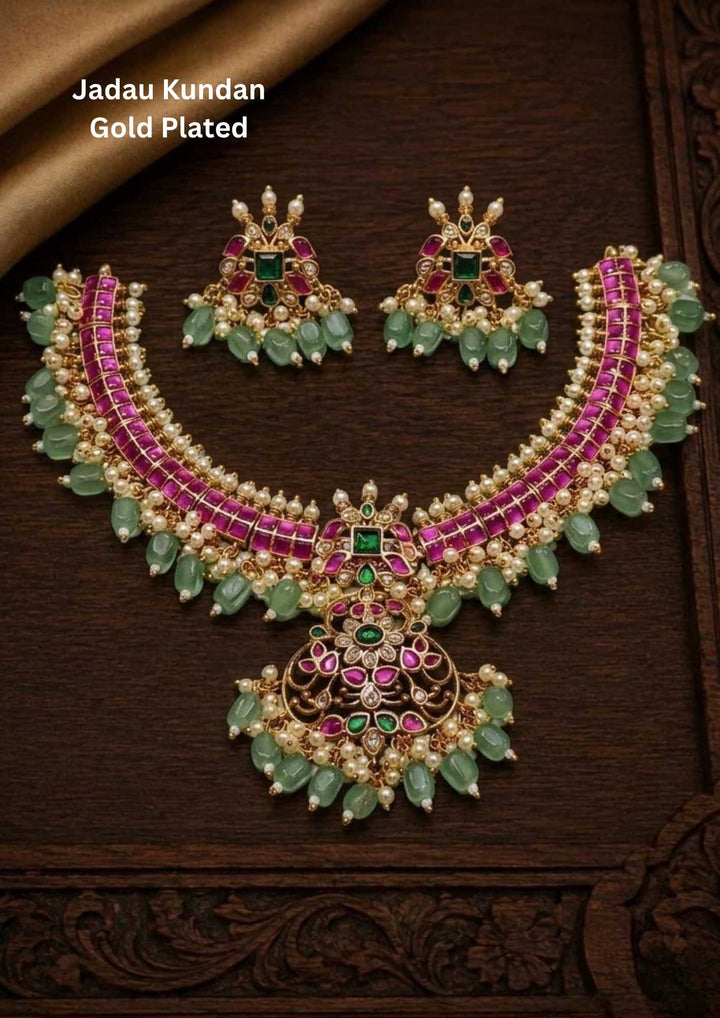 Gold-plated necklace and earrings set with green and red stones  come with beads kante necklace set for traditional look and can be used for festivals, functions  