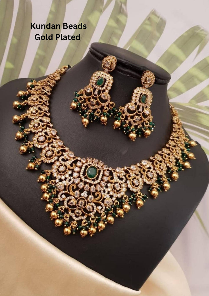 Gold Plated necklace with earrings come with emerald and in picture can see necklace and earrings clearly and can use for weeding's, festivals