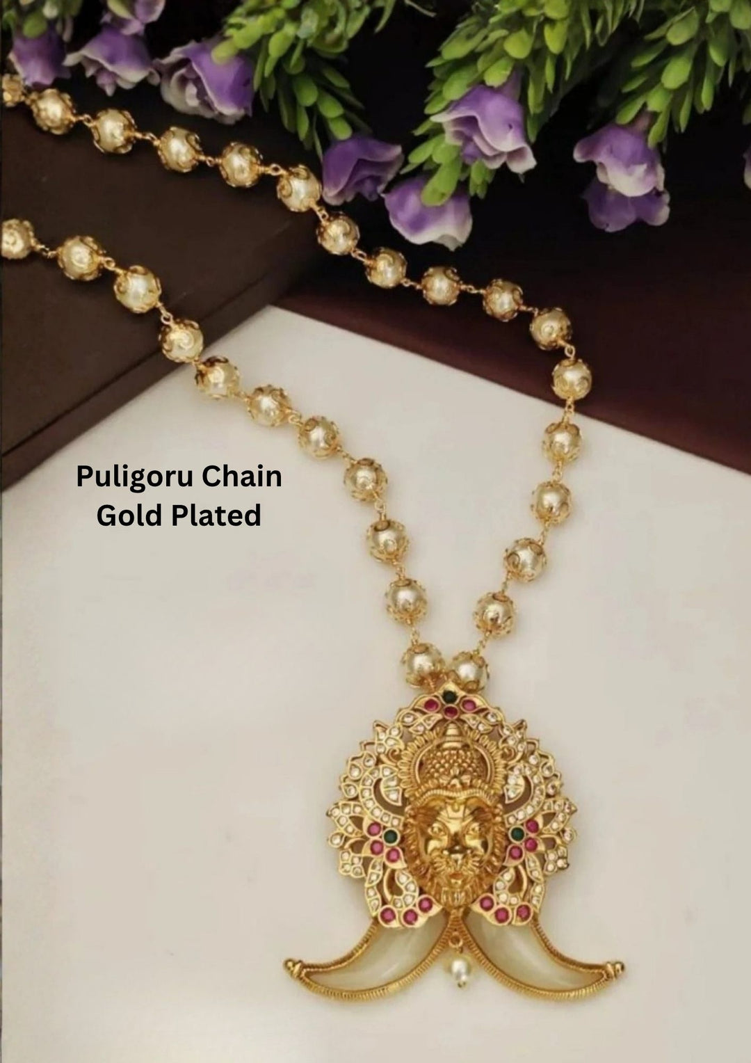 gold plated puligoru chain comes with pearl drop gemstones in pendent and show picture clearly how it looks and anti faded and skin safe and can be used for weeding's , festivals 