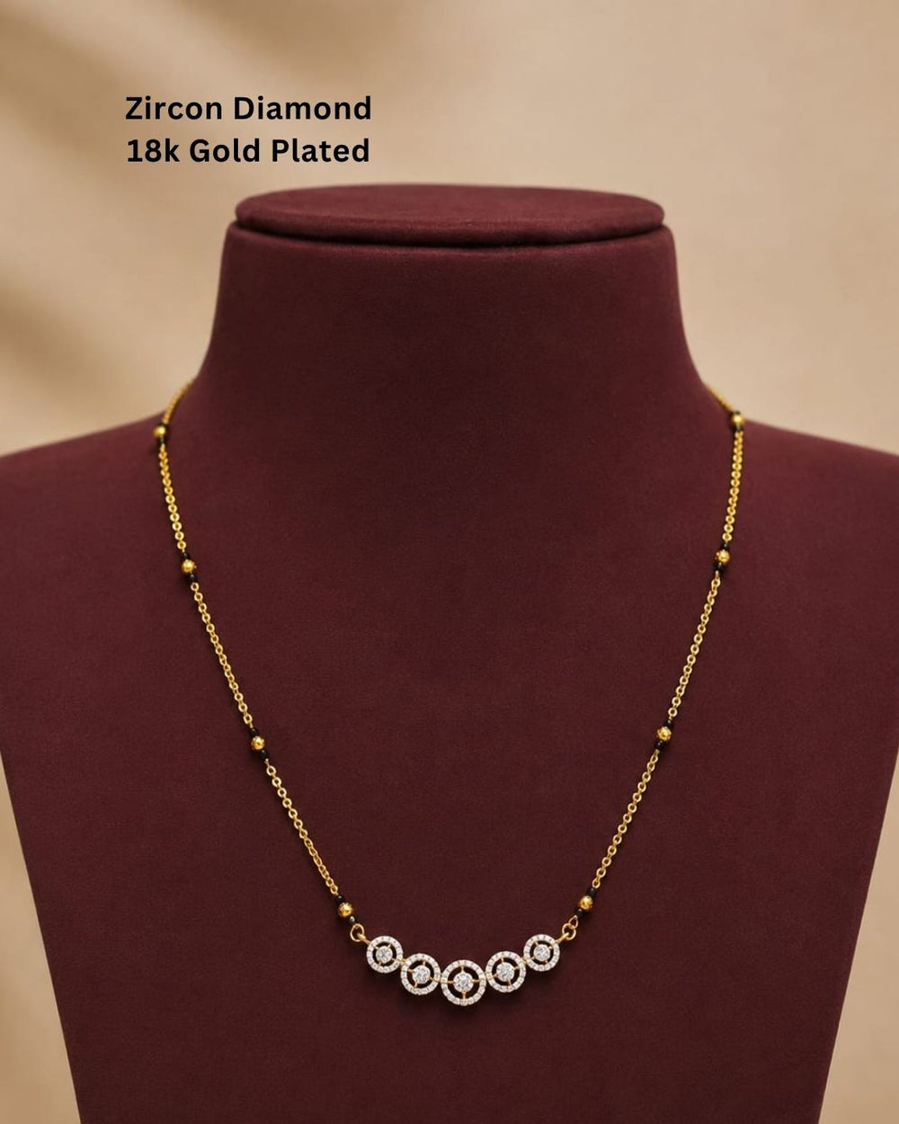 Traditional gold plated mangalsutra necklace with black beads and five shimmering CZ circle accents, ideal for daily and festive wear.