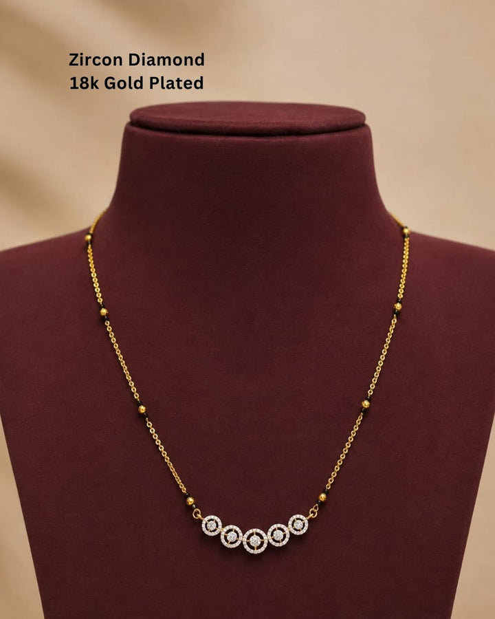 Traditional gold plated mangalsutra necklace with black beads and five shimmering CZ circle accents, ideal for daily and festive wear.