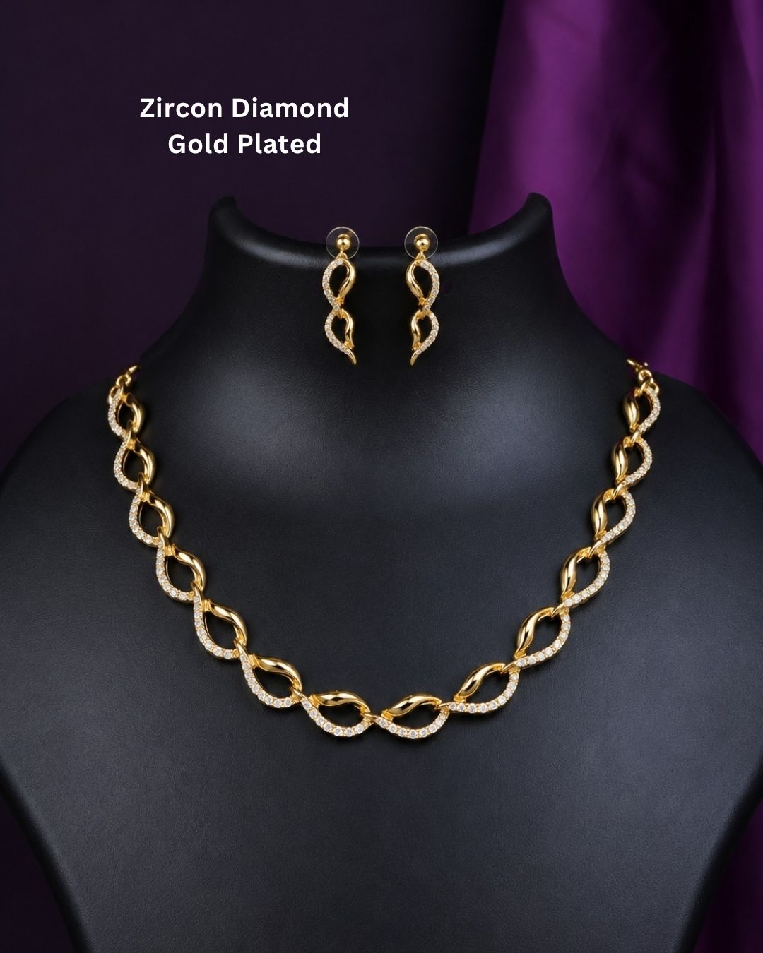 Beautiful gold plated loop necklace set featuring interlinked curved motifs accented with sparkling clear stones and matching elegant drop earrings. Perfect for daily wear, festive occasions, parties, traditional outfits, and premium gifting.