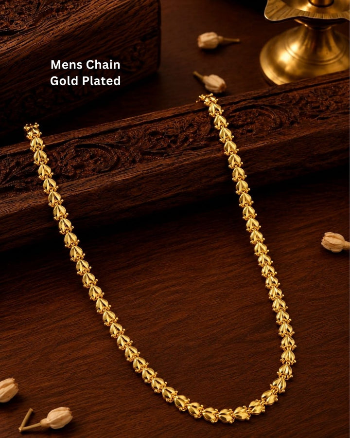 Gold plated men’s chain displayed in hand, showcasing its decorative leaf-shaped links and shiny finish.
