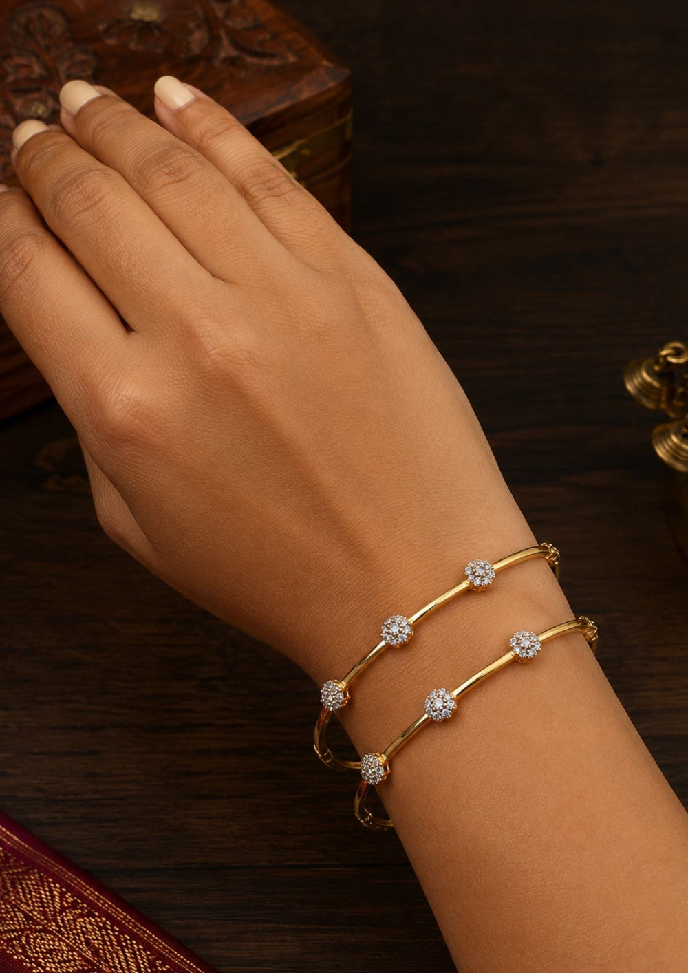 south indian women wearing a gold plated flower bangles come with zircon diamond and in picture shows clearly how it looks looks very classy and simple and ani faded and skin safe and can be used for daily ware, office ware and festivals