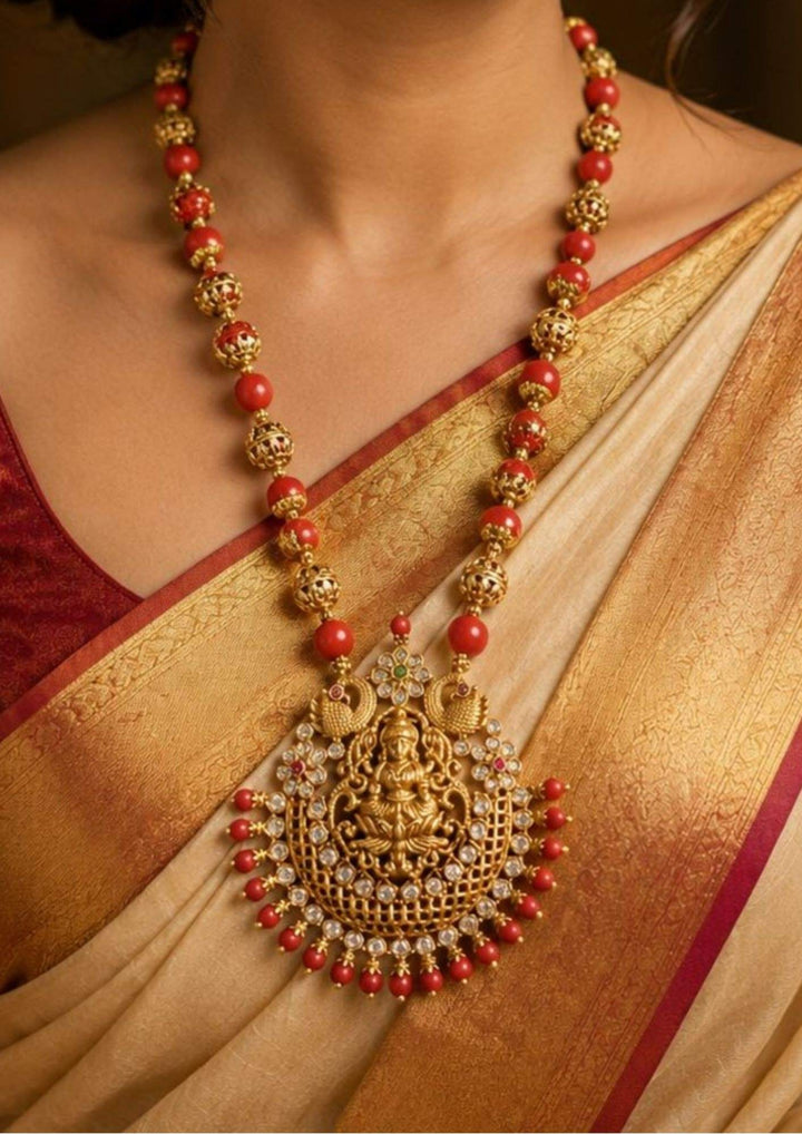 traditional women wore laxmi devi beads coral necklace with peacock design and with shine and good looking and used for  functional , festivals and gifting and wore by south Indian women's 