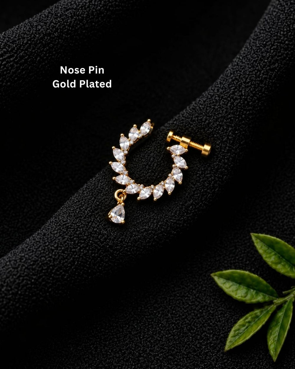 Minimal gold plated crescent nose pin with brilliant white CZ stones and a delicate teardrop stone accent.