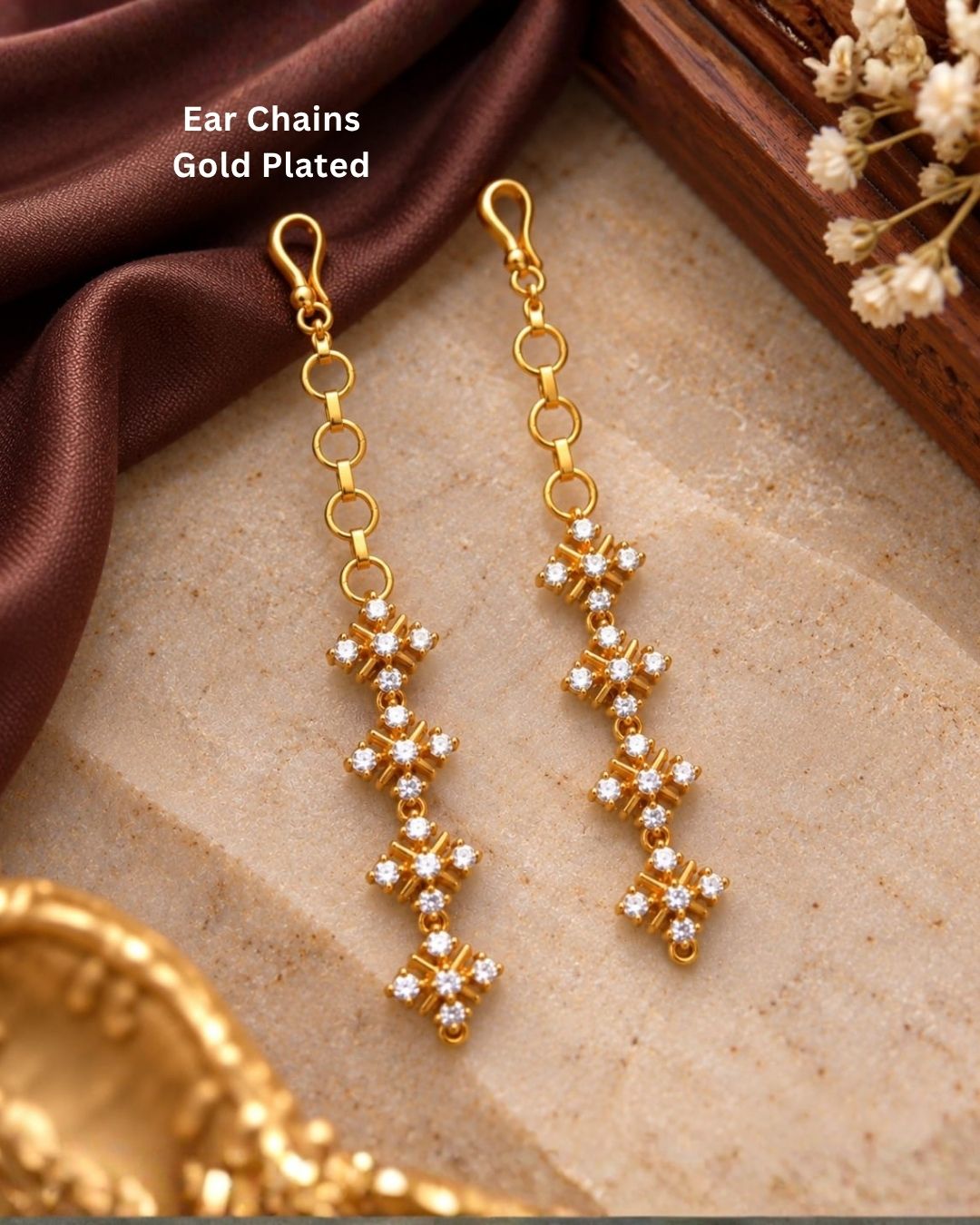 Elegant gold finish ear chains with four floral crystal stone designs arranged vertically for a traditional and sophisticated look.
