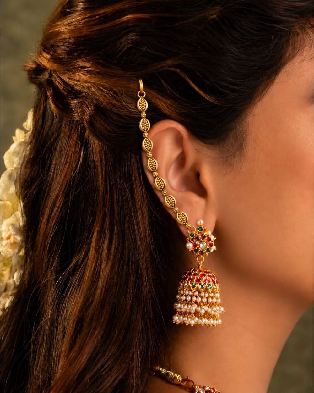 Gold plated traditional ear chains featuring intricate oval motifs, antique-style detailing, and decorative gold bead links
