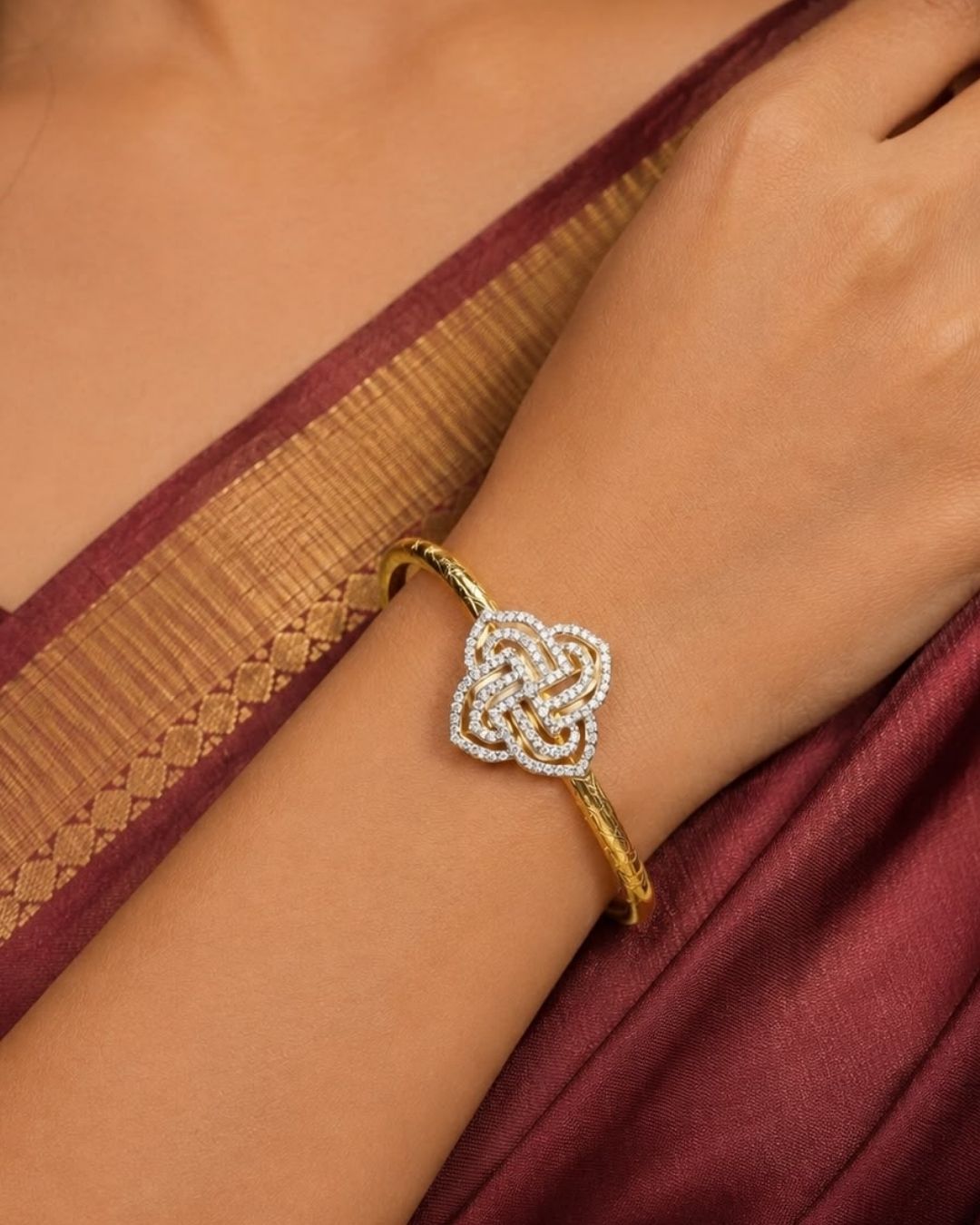 Beautiful gold plated designer kada pair featuring intricate peacock motifs embellished with sparkling CZ stones and subtle pink accents. Perfect for festive occasions, traditional wear, celebrations, and gifting.