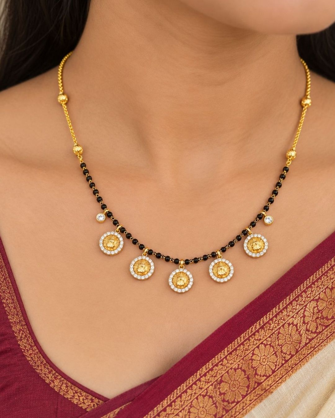 Premium gold plated mangalsutra featuring a classic black bead chain with five elegant circular coin pendants, each surrounded by sparkling clear stones. Perfect for daily wear, traditional occasions, weddings, festive celebrations, and gifting.
