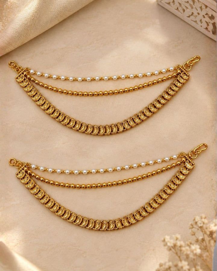 Gold plated traditional ear chains featuring pearl beads, gold ball chains, and intricately detailed antique gold links.
