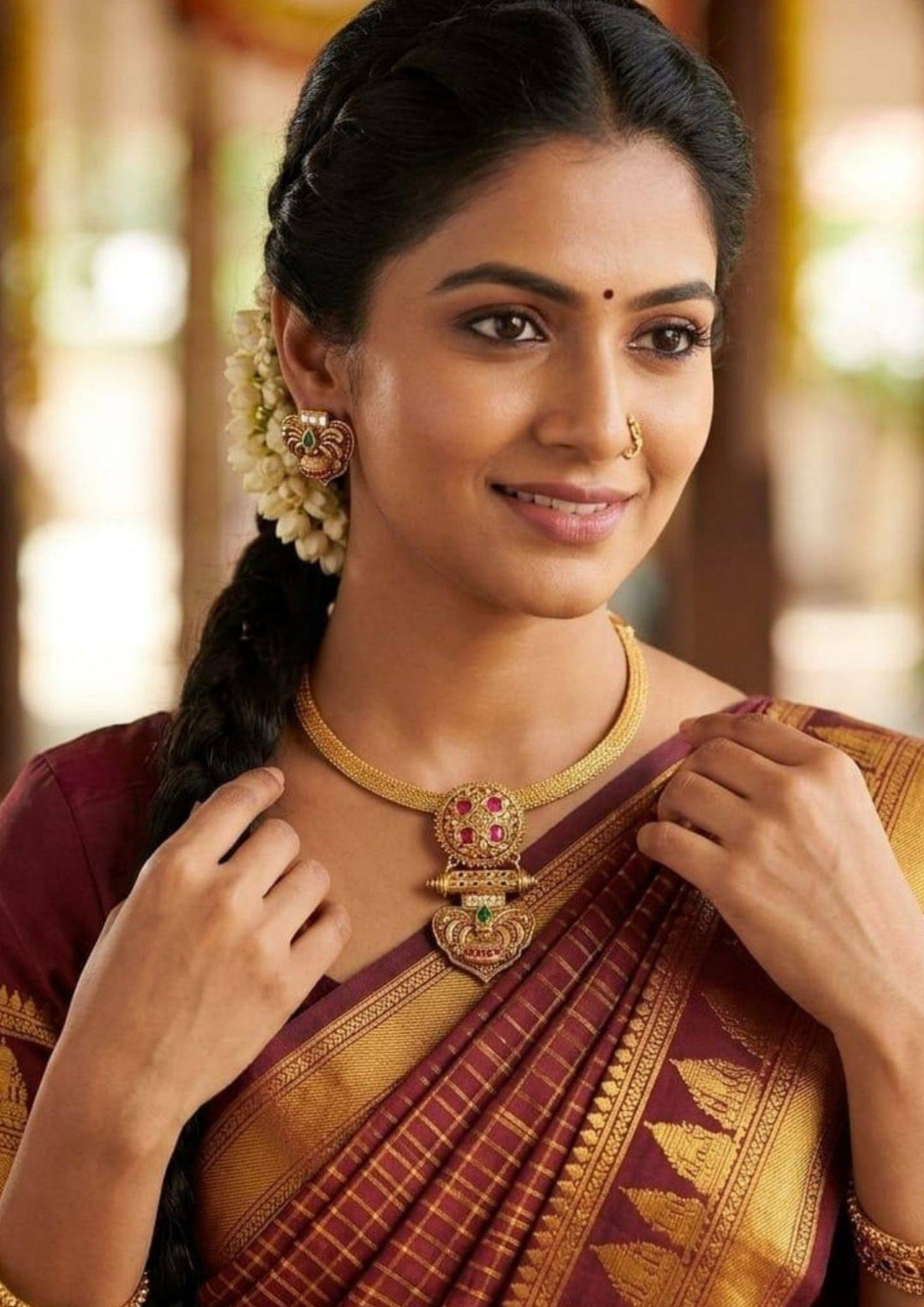 South indian woman wearing a traditional necklace set with detachable pendent gold plated can be used for  flat detail for functional, festive , south indian festivals