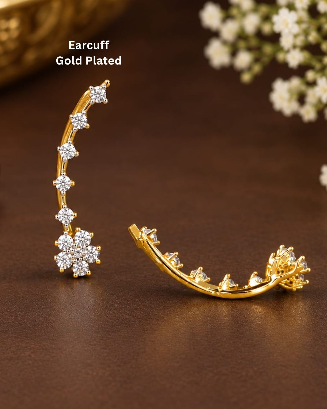 Stylish open gold plated ear cuff decorated with sparkling zircon stones, perfect for modern and festive looks.