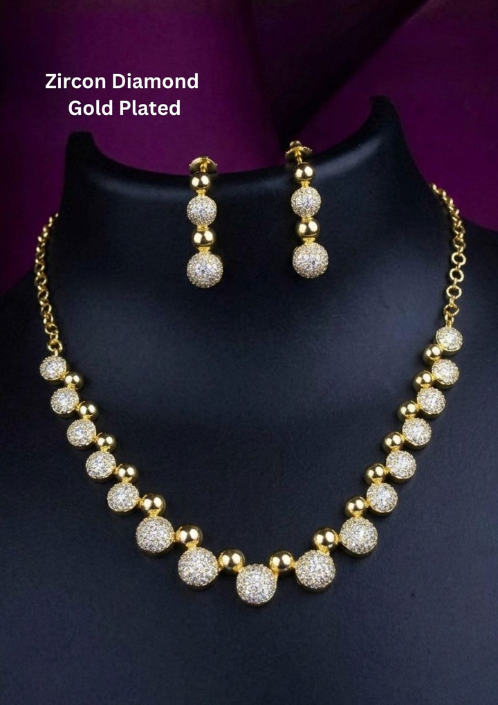 Gold Plated Zircon Diamond necklace set designed in ball model with some pusalu and it comes with matching earrings perfect for weddings, functions, festivals and it is anti fade color and skin friendly best for gifting