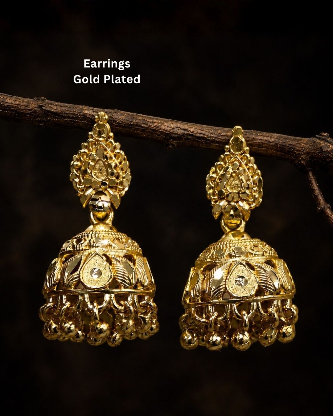 Premium gold plated traditional jhumka earrings featuring intricate ethnic craftsmanship, ornate dome-shaped designs, floral detailing, and elegant hanging gold bead accents. Perfect for sarees, festive occasions, weddings, classical dance performances, and traditional events.