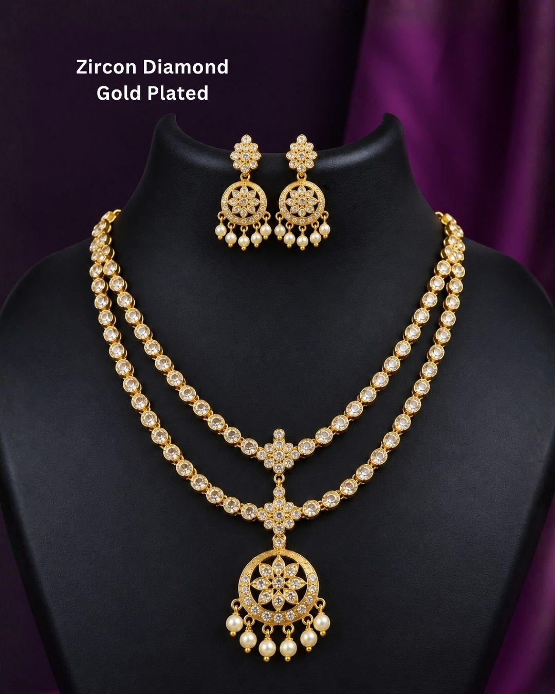 Designer gold plated CZ necklace set adorned with brilliant crystal stones, floral motifs, pearl drops, and matching earrings for festive and party wear.