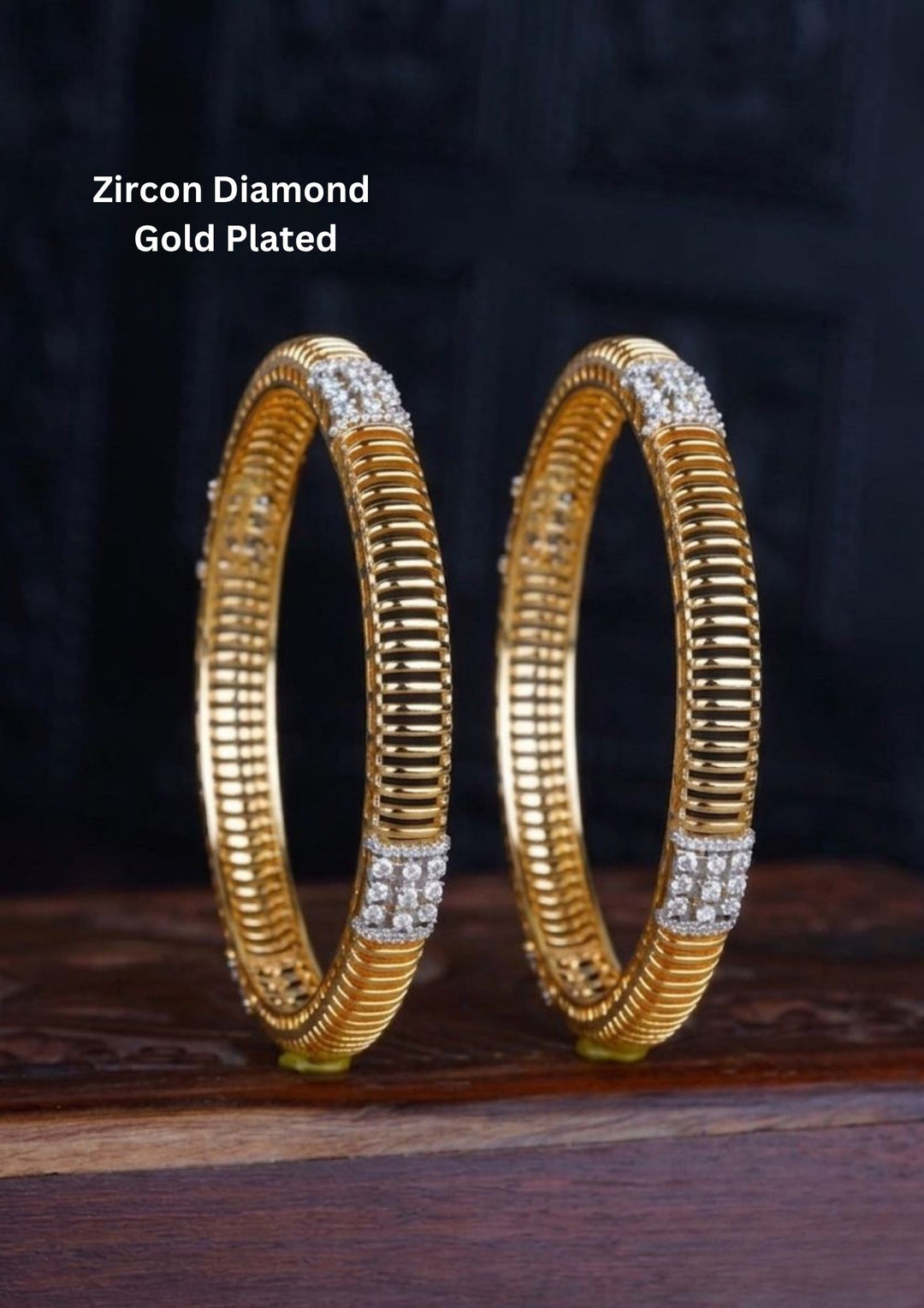 Diamond Gold Plated bangles designed with white cubic zirconia stones and small diamond-shaped stone suitable for daily wear, office styling, or casual festivals.