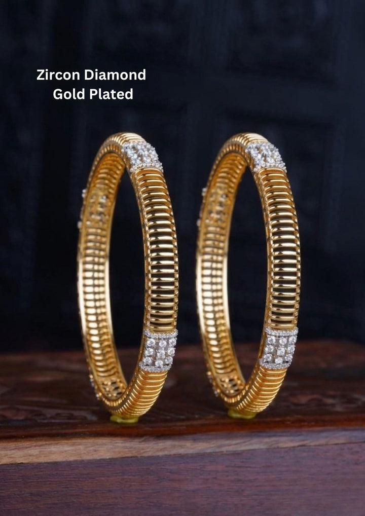 Diamond Gold Plated bangles designed with white cubic zirconia stones and small diamond-shaped stone suitable for daily wear, office styling, or casual festivals.