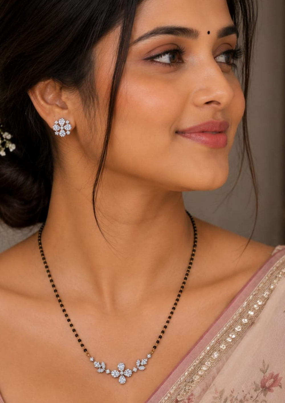 South Indian Woman wearing Gold plated black beads mangalsutra featuring an elegant Flower -inspired zircon centerpiece with delicate curved detailing. Lightweight and beautifully crafted for everyday elegance, festive occasions, and gifting.