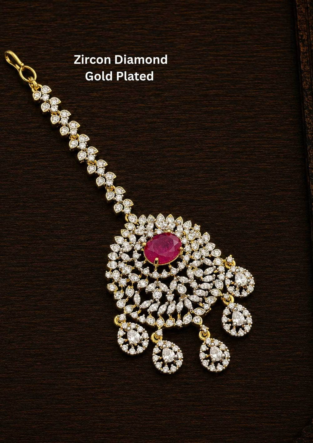 Gold-plated Zircon Diamond Mangtikka (papidi billa) shows in picture clearly how it looks and comes with Red stone and can be used for weeding's and festivals 