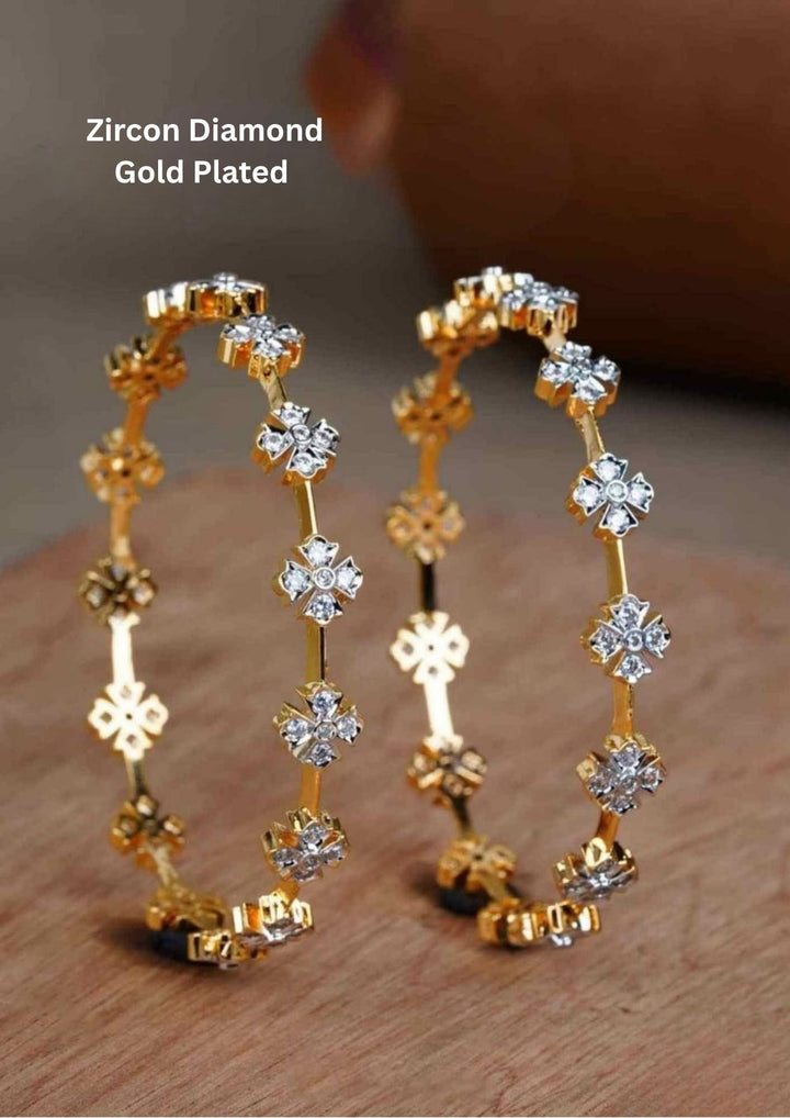 gold plated flower bangles come with zircon diamond and in picture shows clearly how it looks looks very classy and simple and ani faded and skin safe and can be used for daily ware, office ware and festivals