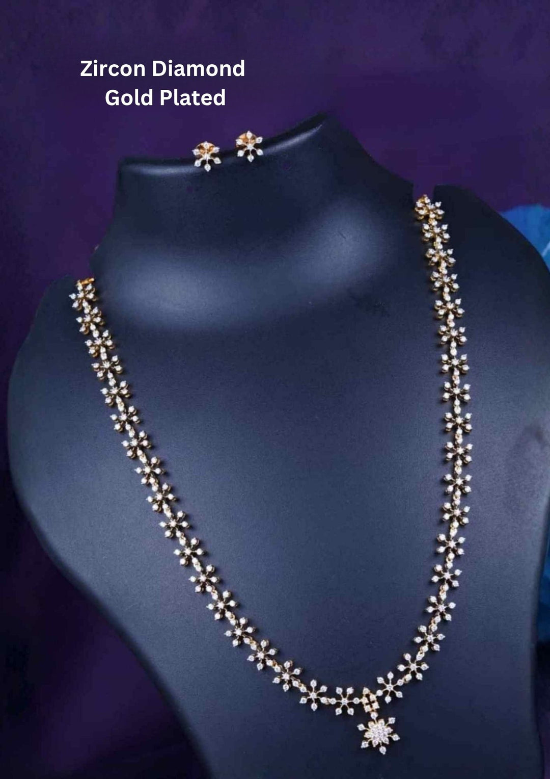 Zirconian Diamond Gold Plated long chain necklace and matching stud earrings set. The jewelry designed with floral pattern made of sparkling cube zirconia stones on a gold-plated base for festivals, temple visits, weddings, functions and dailywear