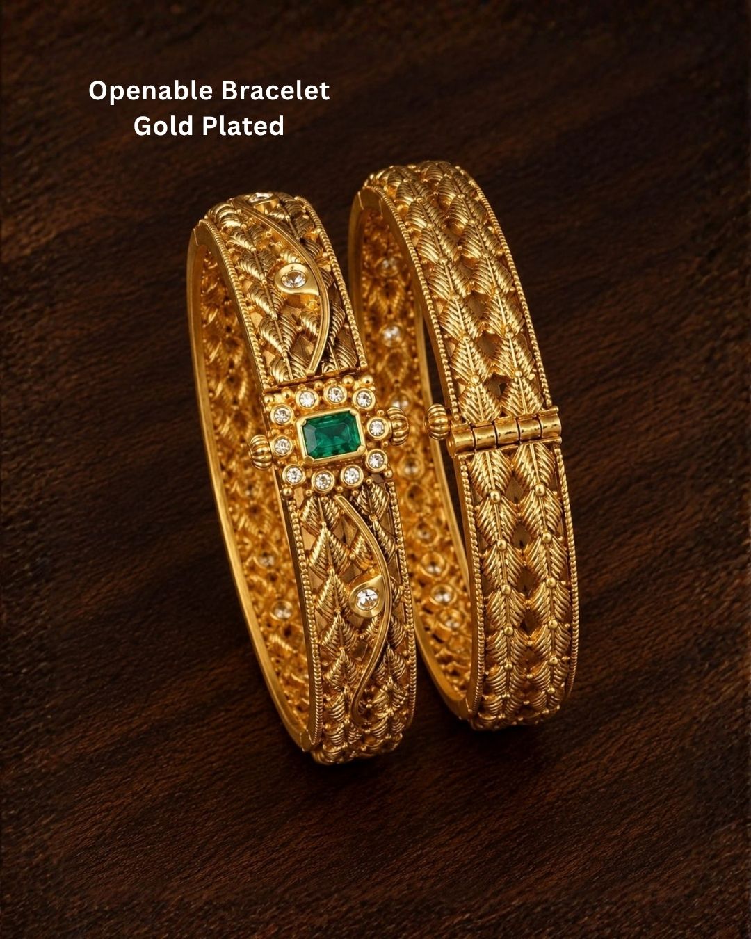 Traditional gold plated designer bangles featuring intricate layered leaf motifs, sparkling white stone embellishments, and a vibrant green center stone, perfect for festive, wedding, and traditional occasions.