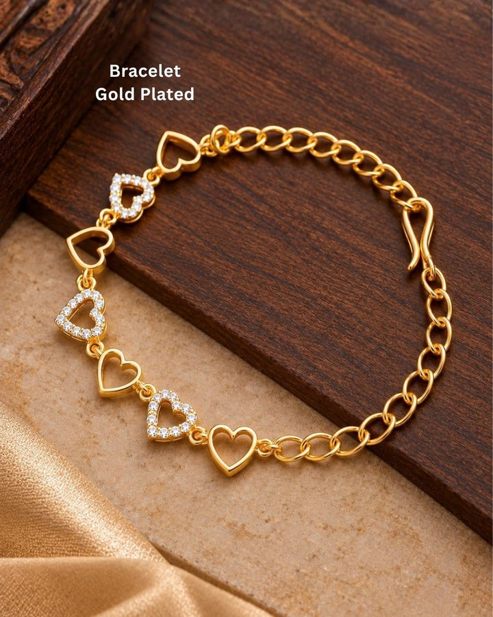 Elegant gold plated women’s bracelet featuring multiple heart-shaped charms, sparkling zircon detailing, and a classic link-chain design, perfect for everyday and special occasions.