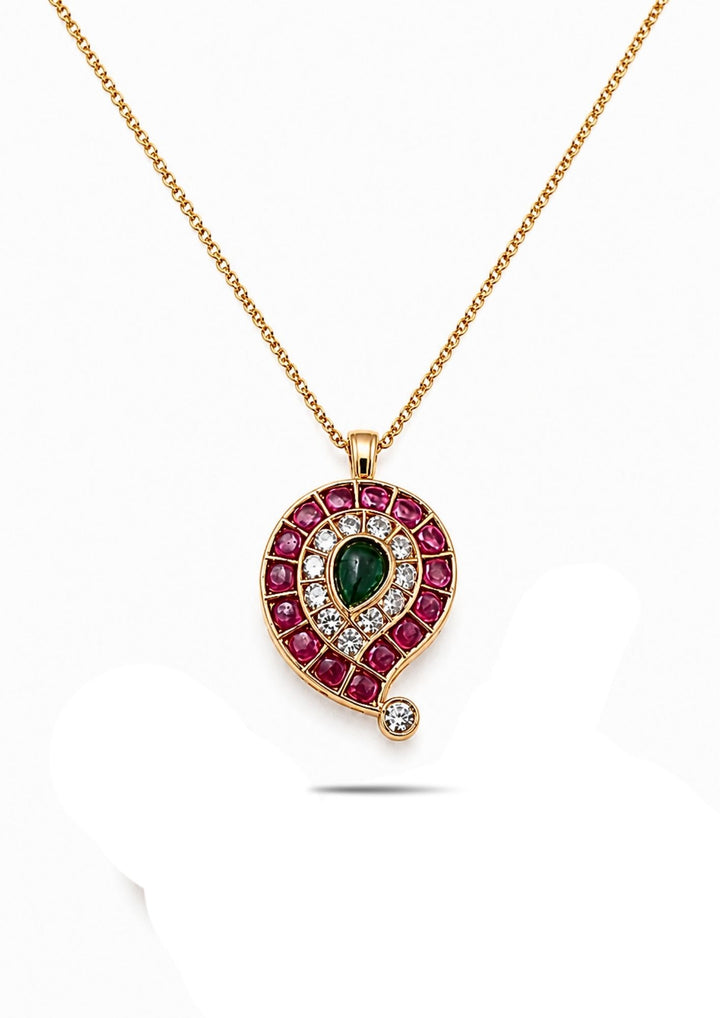 Gold Plated mango pendant locket designed with mango shape pattern with pink ruby style stones, emerald green center stone with white zircon and the chian in the link patteren design in 18k gold plating. This elegant ethnic pendant comes with lightweight comfort, sweat proof quality, anti-fade colour, skin-friendly finish, and smooth fitting suitable for weddings, festivals, traditional wear, parties, and gifting purposes. 