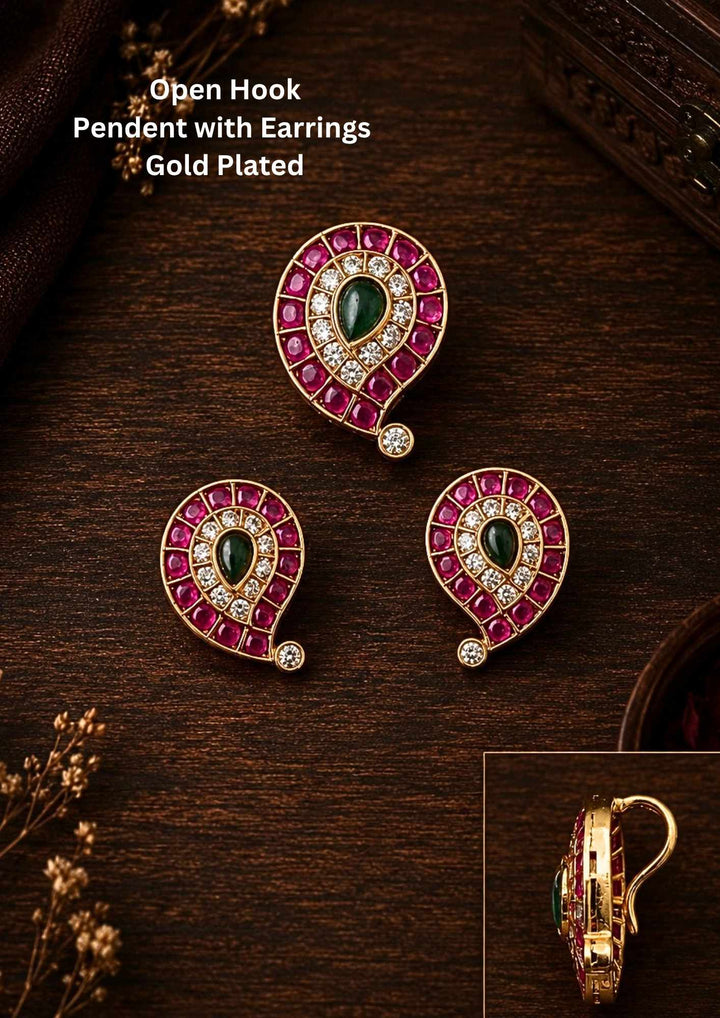 Jadau Kundan Gold Plated mango pendant set with matching earrings designed in traditional mango shape pattern with pink ruby stones, green center kundan stone, and sparkling white zircon detailing. The pendant is with open hook style and finished in rich 18k gold plating that gives a royal ethnic jewelry look. This lightweight jewelry set comes with sweat proof quality, anti-fade colour, skin-friendly finish, smooth fitting, and is suitable for weddings, festivals, dailywear